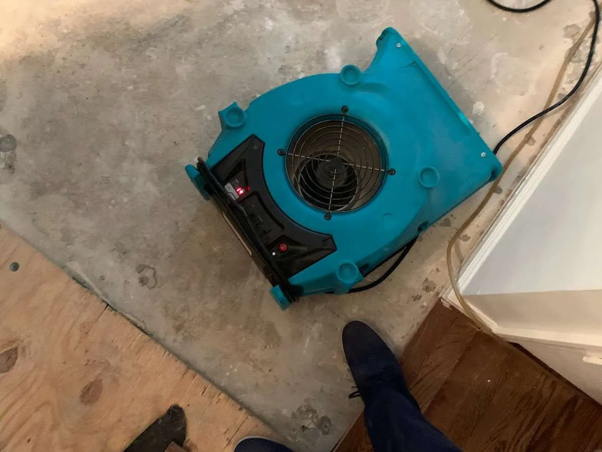Air mover drying subfloor during Leak Detection & Repair in California Polytechnic State University